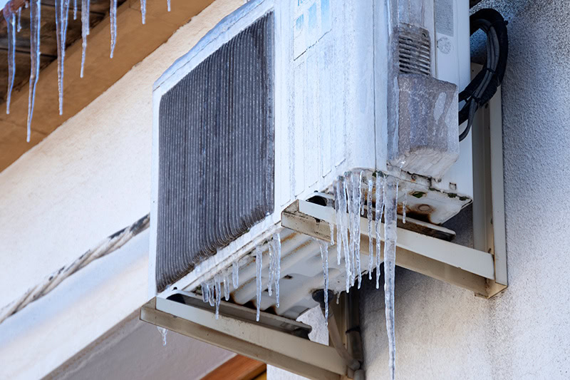 A frozen heat pump unit.